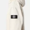 Anorak mit abnehmbarem Kapuzenfutter und Kinnriemen Anorak mit abnehmbarem Kapuzenfutter und Kinnriemen