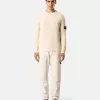 Chino-Hose mit lockerer Passform und elastischem Bund. Chino-Hose mit lockerer Passform und elastischem Bund.