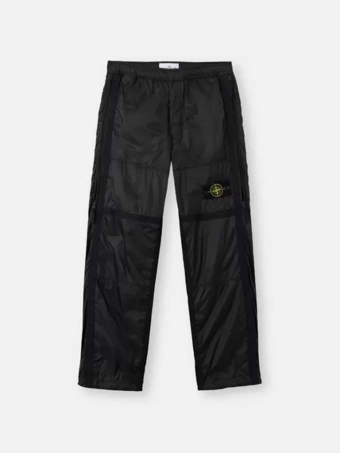 Lockere Jogginghose mit Reißverschlusstaschen und verstellbaren Bündchen Lockere Jogginghose mit Reißverschlusstaschen und verstellbaren Bündchen