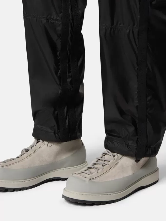 Lockere Jogginghose mit Reißverschlusstaschen und verstellbaren Bündchen Lockere Jogginghose mit Reißverschlusstaschen und verstellbaren Bündchen